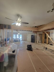 A ladder in a game room with new recessed lighting and a ceiling fan, indicating electrical work by LeoElectricservice in Frisco, TX.