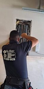 A ladder positioned near a ceiling fan and newly installed recessed lights by LeoElectricservice in Frisco, TX.