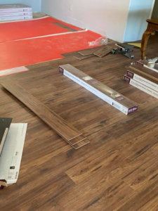 Laminate or vinyl plank flooring installation in progress by Carpet Club in Escondido, CA