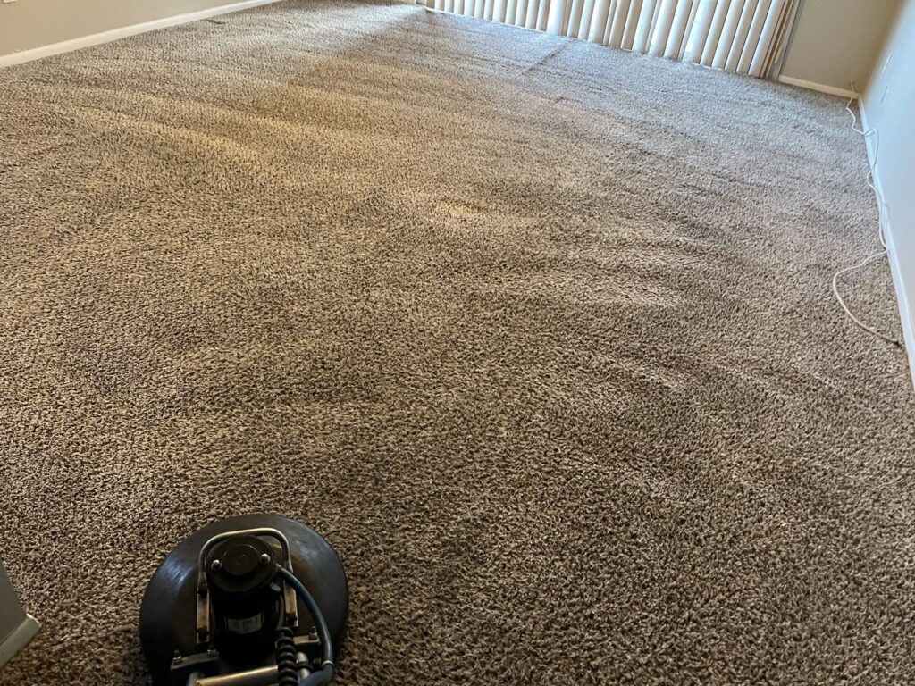 A rotary machine cleaning a large carpeted area in a home by Fusioncarpetcleaning in Fort Walton Beach, FL