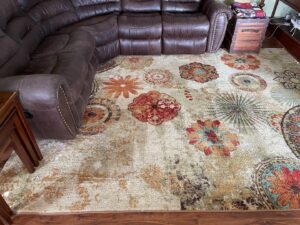 A large, colorful area rug in a living room, professionally cleaned by Select Carpet Clean LLC in Scranton, PA.