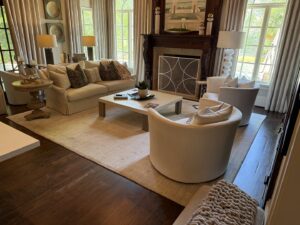 A large, light-colored area rug anchoring a cozy living room space by Advanced Cleaning Systems in Atlanta, GA.