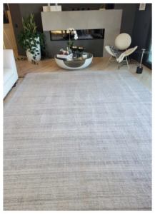 A large, light-colored area rug in a modern living room by JP Carpet Cleaning Expert Floor Care in Granada Hills, CA