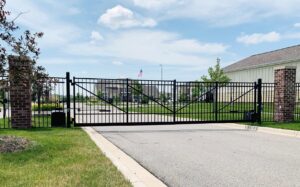 A large black metal entrance gate installed by American Fence Company of Columbus in Grand Island, NE.