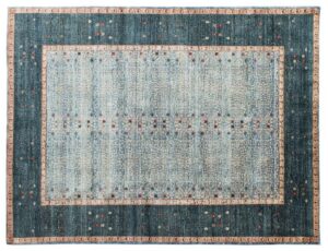 An overhead view of a large blue and light blue patterned rug, a product available from Yayla Tribal Rugs, Inc. in Cambridge, MA.