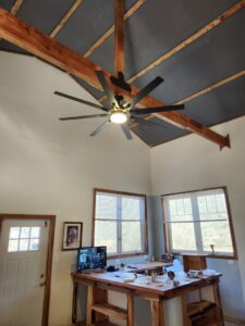 A large ceiling fan with a light installed in a room by ABS Electrical Services in Rogers, AR.