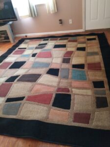 A large, colorful area rug on a hard floor after professional cleaning by My Dad's Floor and Upholstery Cleaning in Sacramento, CA.