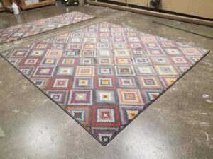 A large colorful geometric pattern area rug with bound edges, a custom creation by Carpet Binding By Scott in Oklahoma City, OK