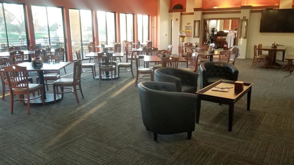 A spacious commercial dining area with modern carpet tile flooring installed by Timeless Flooring in Peoria, AZ