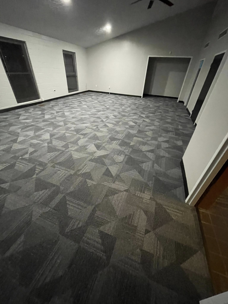 A large commercial space featuring new patterned carpet tile installation by A Step Above Flooring in Lexington, KY
