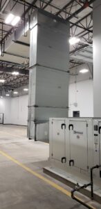 A large commercial HVAC air handler unit and extensive ductwork installed by HVAC Solutions in Colorado Springs, CO