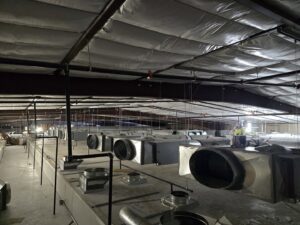 Extensive commercial HVAC ductwork and insulation being installed in a large building by State 48 Home Comfort LLC in Peoria, AZ.