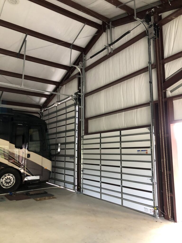 Large commercial or RV garage door installation in a tall building, completed by Superior Garage Door & Repairs in Lafayette, LA.