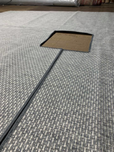 A large custom carpet installation with bound edges, showcasing work by Carpet Ends in West Springfield, MA.