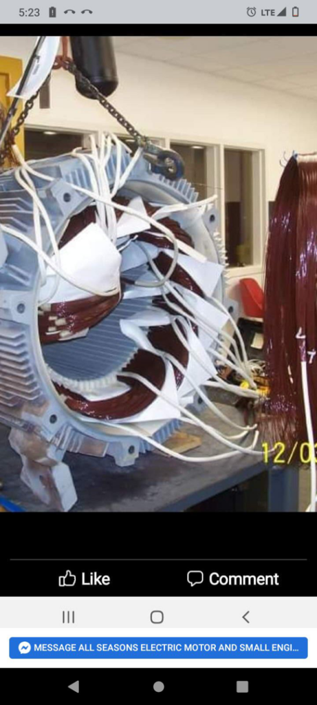 A large electric motor stator with new windings being installed by All Seasons Electric Motor and Small Engine Repair in Fayetteville, NC.