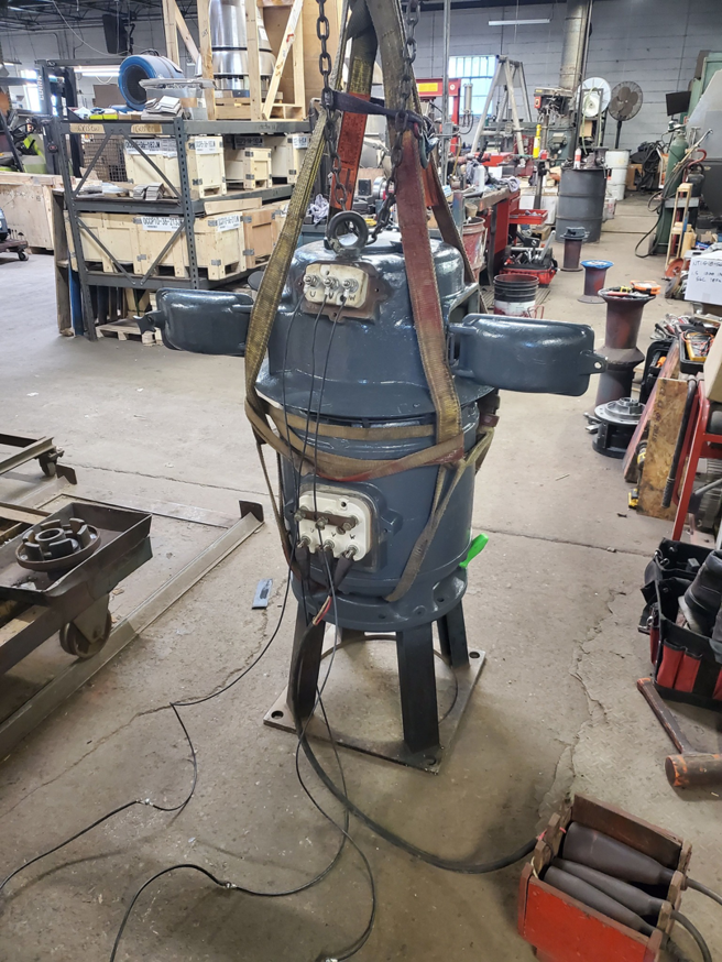 A large electric motor undergoing testing or repair, a service provided by Caddell Electric Co Inc in Dallas, TX.