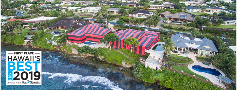 An aerial view of a large house tented for termite fumigation by Kama'aina Termite and Pest Control in Honolulu, HI.