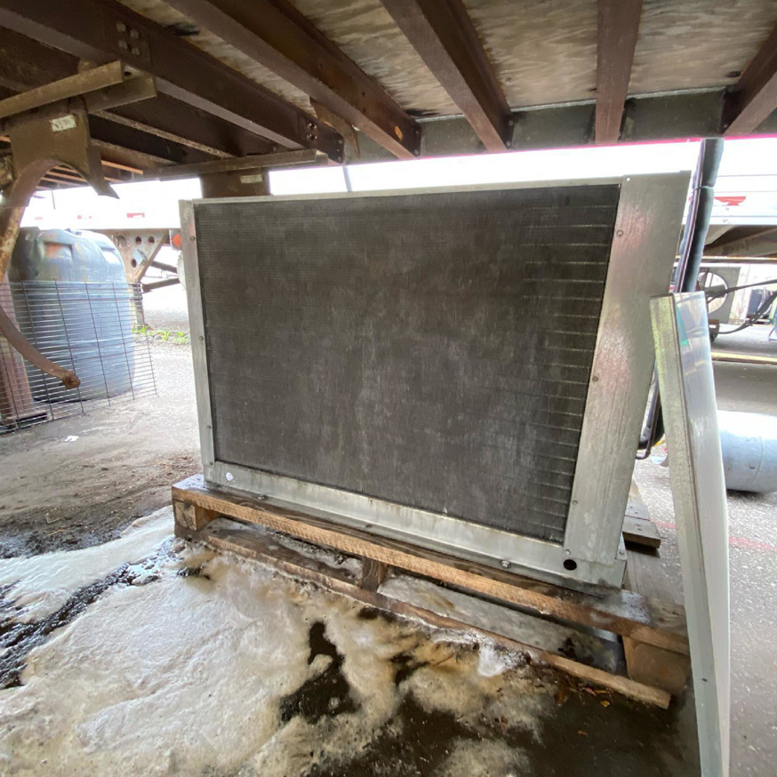 A large HVAC condenser coil, possibly for commercial refrigeration, serviced by Doctor Air HVAC in Philadelphia, PA.