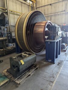 A large industrial electric rotor component with copper elements, indicating specialized electrical work at Hannon Electric Company in Canton, OH.