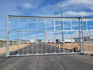 A large industrial security gate installed for commercial property by SFA Contracting LLC, a fencing contractor in Tucson, AZ.
