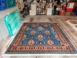 A large, ornate oriental area rug laid out for cleaning or inspection by Right & Clean Atlanta 24-7 Carpet Cleaning in Atlanta, GA.
