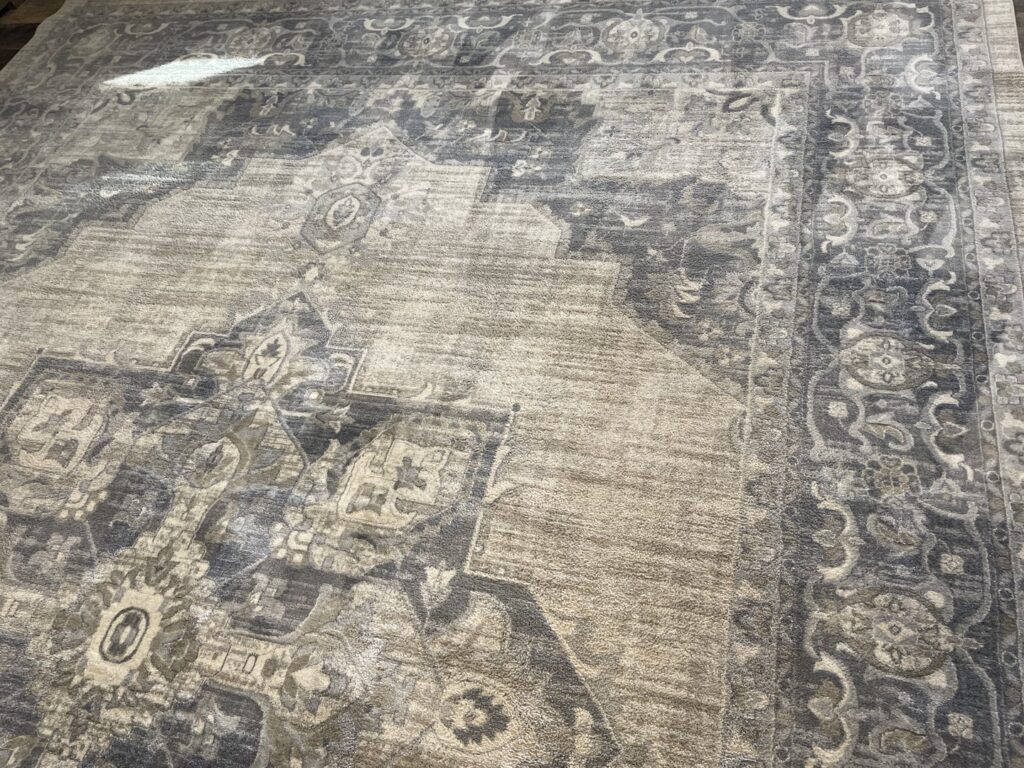A close-up of a large, clean patterned area rug, professionally cleaned by Clear Vision Carpet & Floor Care, Inc. in Newnan, GA.
