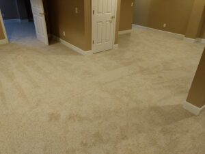 A large room featuring a fresh light beige carpet installation, completed by Home Based Carpet & Flooring in Cincinnati, OH.