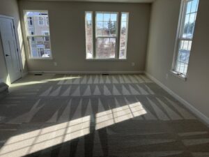 A large room with a perfectly cleaned carpet showing fresh patterns by Oxi Fresh Carpet Cleaning in Frederick, MD