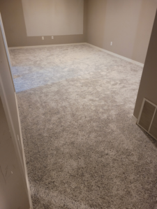 New light grey carpet installation in a large room by Rendon Flooring in Green River, WY.