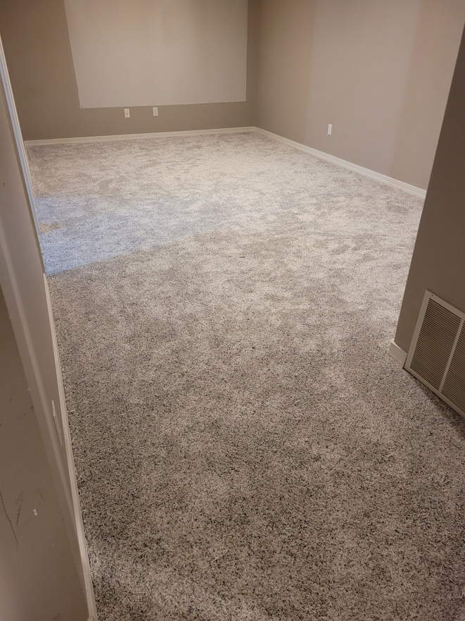 New light grey carpet installation in a large room by Rendon Flooring in Green River, WY.
