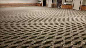 A large room with newly installed patterned carpet, a completed job by Bozeman Flooring in Bozeman, MT.