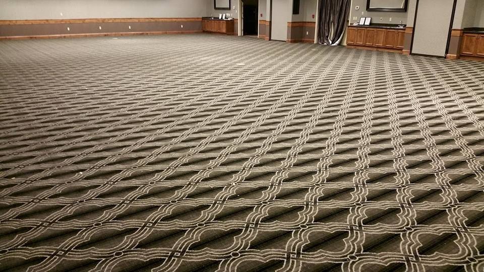 A large room with newly installed patterned carpet, a completed job by Bozeman Flooring in Bozeman, MT.