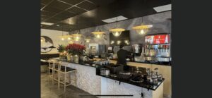 A large room with numerous recessed ceiling lights installed by Homestead Electric in Orem, UT.