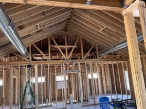 Large round metal ductwork installed in a new construction ceiling by QC Mechanical, Inc. in Lockport, NY.