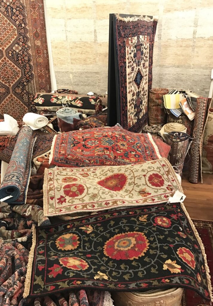 A large selection of various oriental rugs, both rolled and folded, available at Robert Fritz Oriental Rugs, Inc. in Raleigh, NC