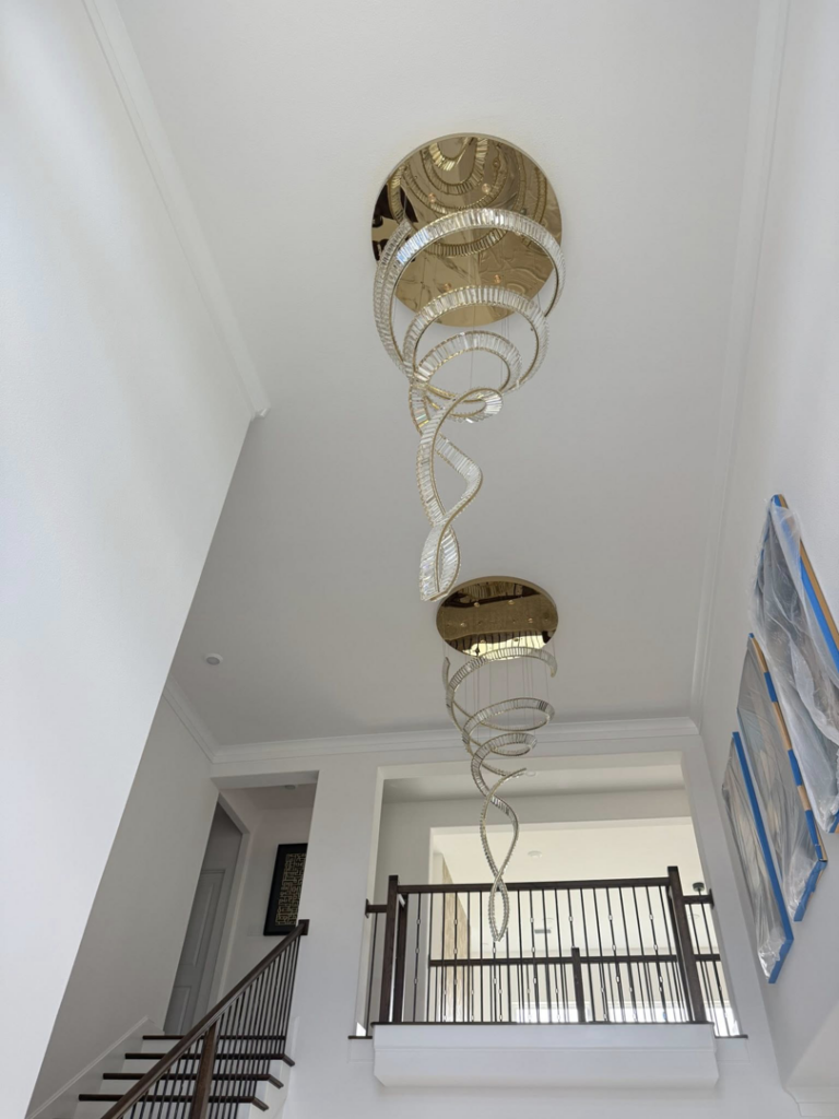 Large, elaborate spiral chandelier installation by LMV Electric LLC in Houston, TX