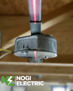 A laser level being used for precise electrical conduit installation by Nogi Electric LLC in Mesa, AZ.