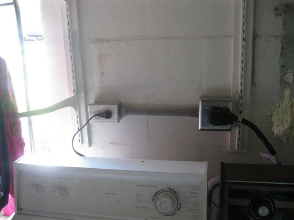 Laundry room electrical outlet and conduit installation by Acme Electrical & Ac Services Inc in Tampa, FL.