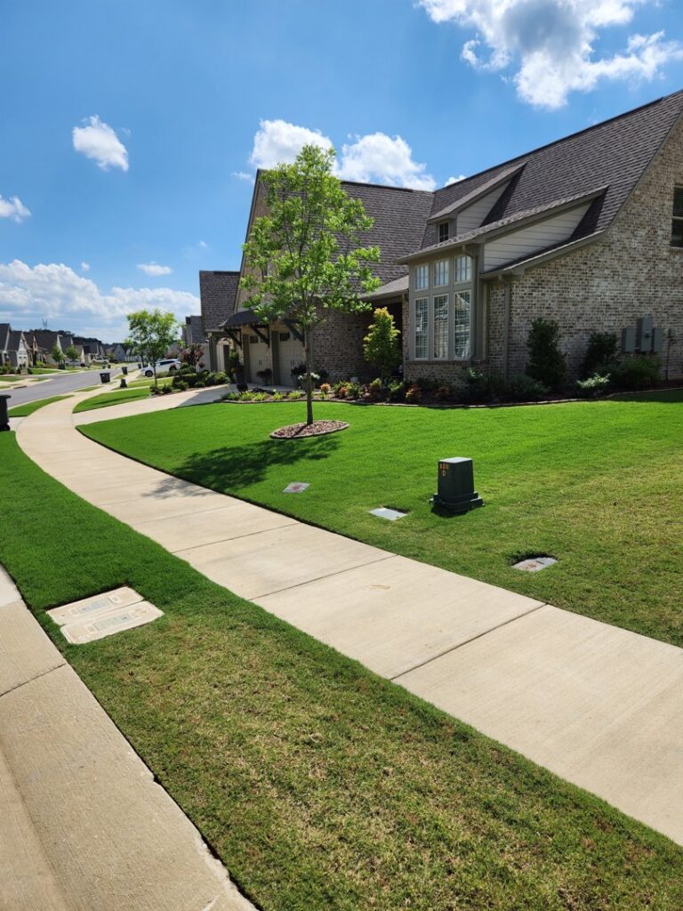 Lawn pest control devices strategically placed around a residential home by TDI Lawn & Pest - Birmingham, AL.