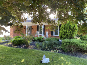 Lawn treatment sprayer in a well-maintained front yard by Sonner And Sons Lawncare in Fort Wayne, IN.