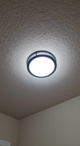 A bright LED ceiling light fixture professionally installed by Rain Man Thee Handyman in Hampton, VA.