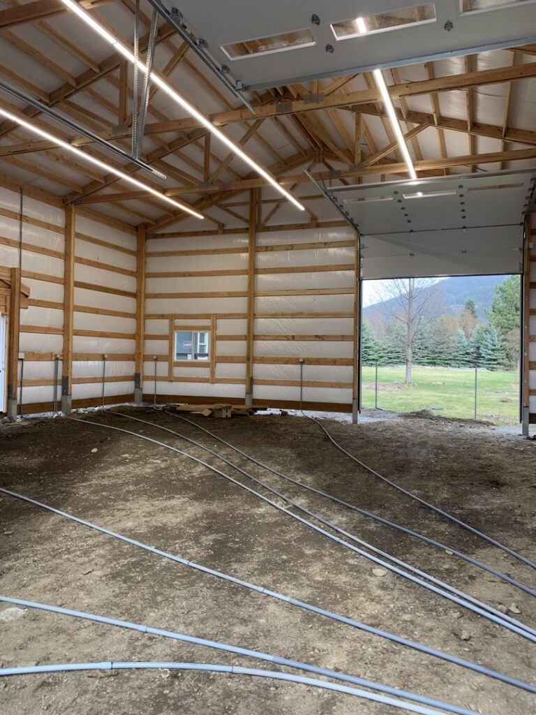 Linear LED lighting installed on the ceiling of a large building under construction by Interstate Electrical Contractors in Dalton Gardens, ID.