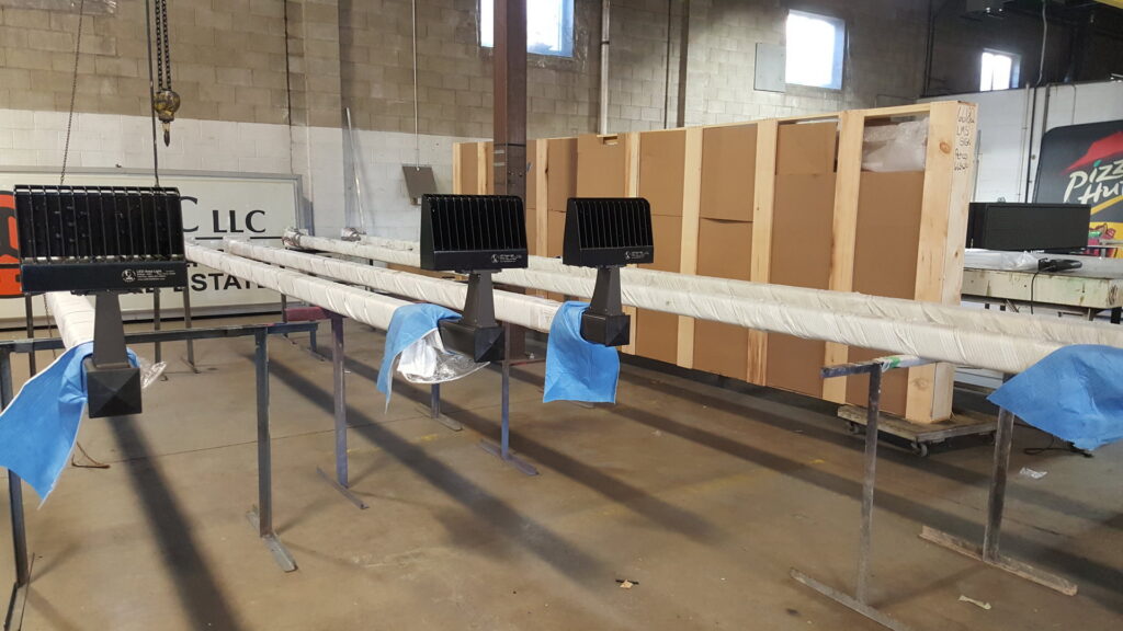 LED sign lighting fixtures being prepared for installation at the LMS Energy workshop in Milwaukee, WI.
