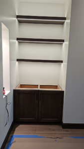 Newly installed LED strip lighting on built-in shelves by JGM Electric INC. in Glendale, AZ