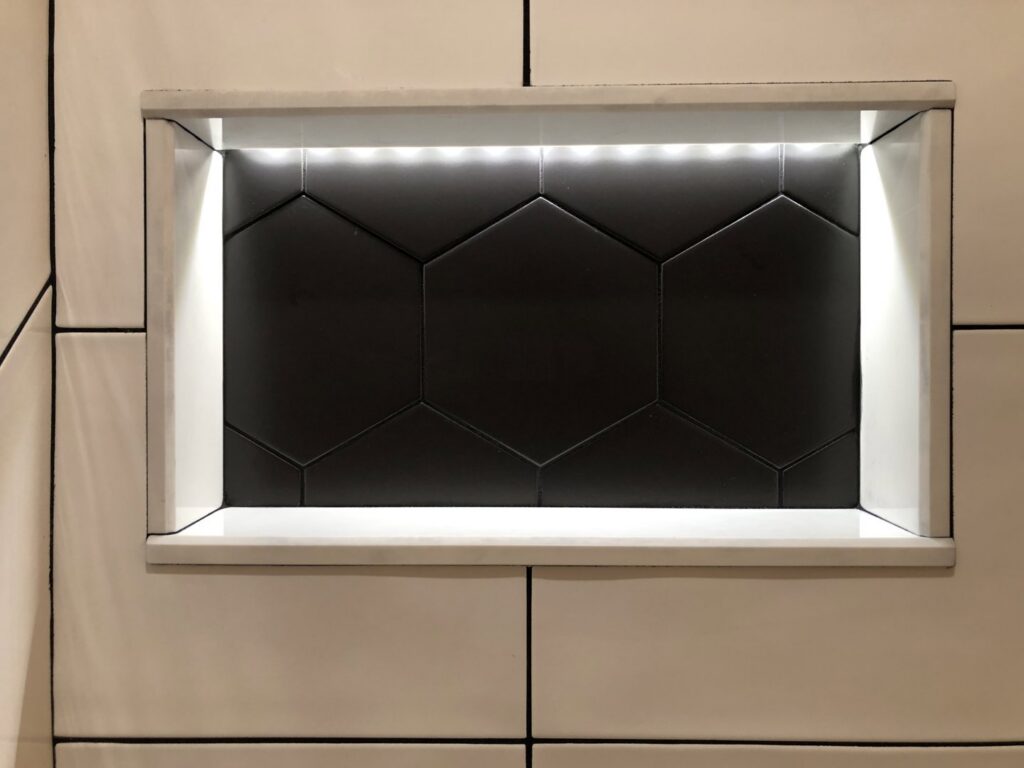 A recessed wall niche featuring modern LED strip lighting installed by Harbour Electric in Wilmington, NC.
