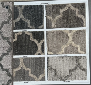 A display board featuring six patterned carpet samples from the Legendary collection by Erin Wruck Consulting LLC in Converse, TX