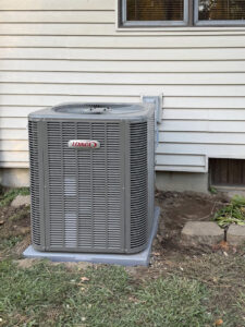 An outdoor Lennox AC condenser unit professionally installed by Home Run Mechanical in Ann Arbor, MI.