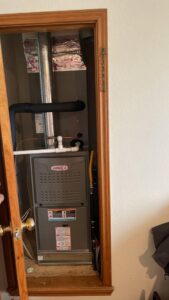 A Lennox furnace and air handler unit installed in a utility closet by AirTech Solutions LLC in Broken Arrow, OK.