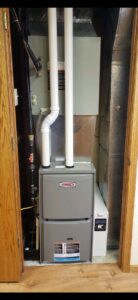 A Lennox furnace and air handler unit installed in a utility closet by Preferred Heating & Air in Bismarck, ND.