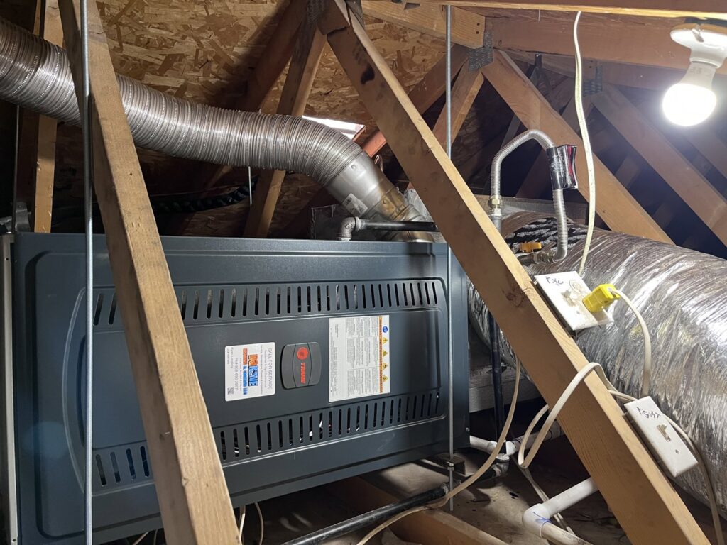 A Lennox furnace and air handler unit installed in an attic by Dakine Heating & Cooling, LLC in Las Vegas, NV.